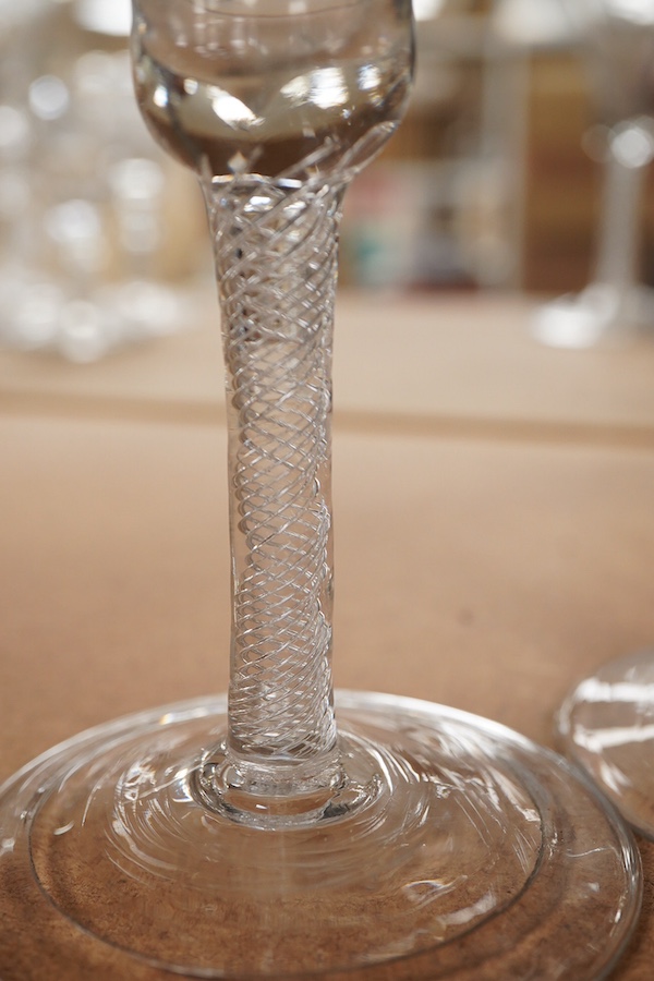 Three 18th century trumpet glasses, two with air twist stems (one with folded foot), together with another with a knopped stem and tear, tallest 16.5cm high